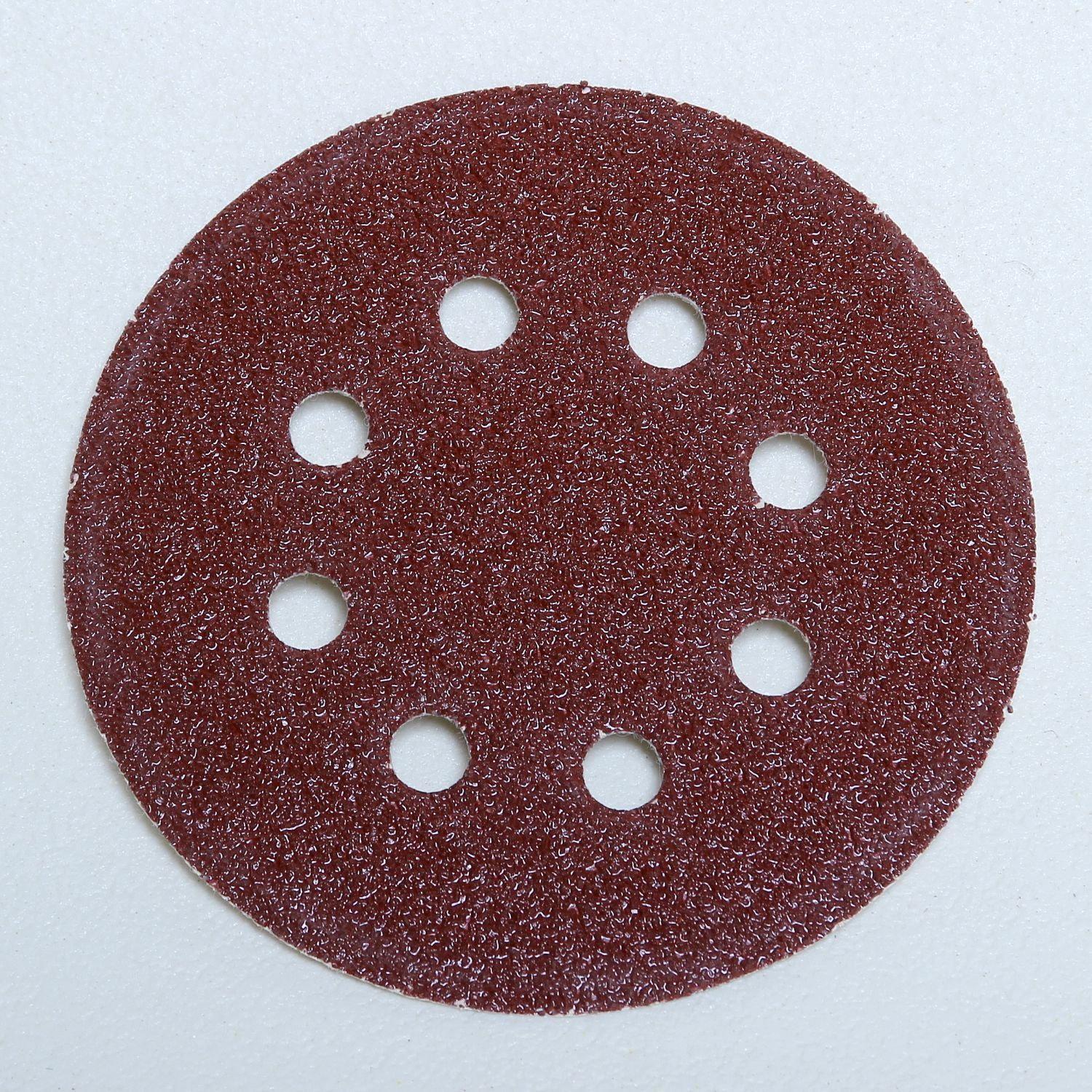 Ümmargune liivapaber puurida aukudega lihvimiseks