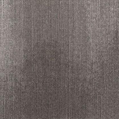 Hallikarva tekstuuriga metalli pind lähedalt vaadelduna.