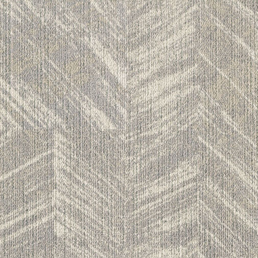 Hallide mustriga vaip helehallis toonis.