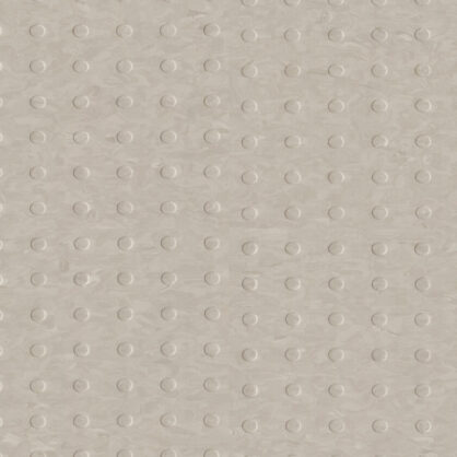 Beež tekstuuriga pind väikeste ümmarguste mustritega.