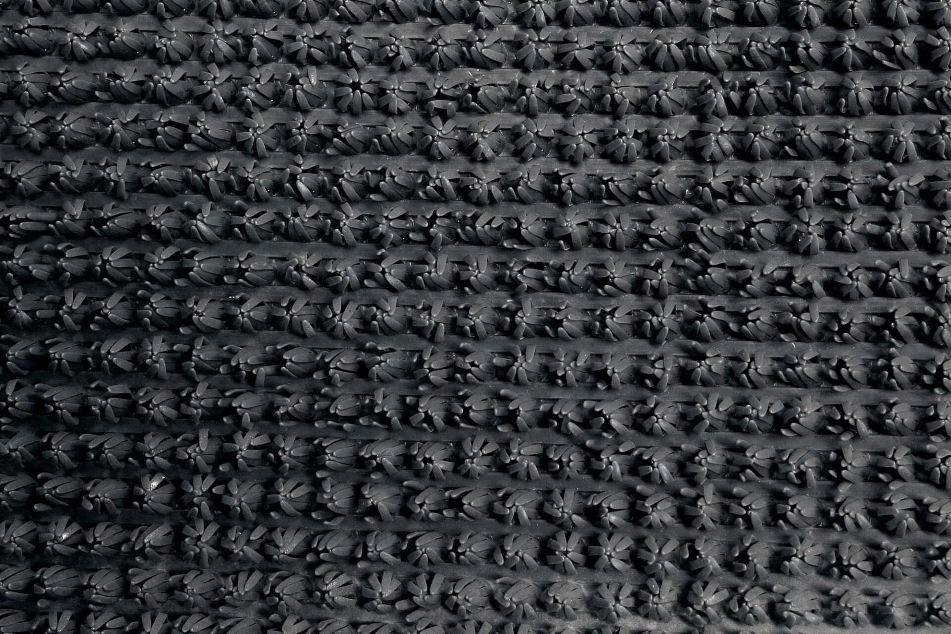 Mustri detail süsimustal kangal lähedalt vaadatuna